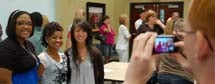 Marci Long, Danielle' Broome and Aimi Nguyen smile as Austin Gregg snaps a photo of the new roommates.